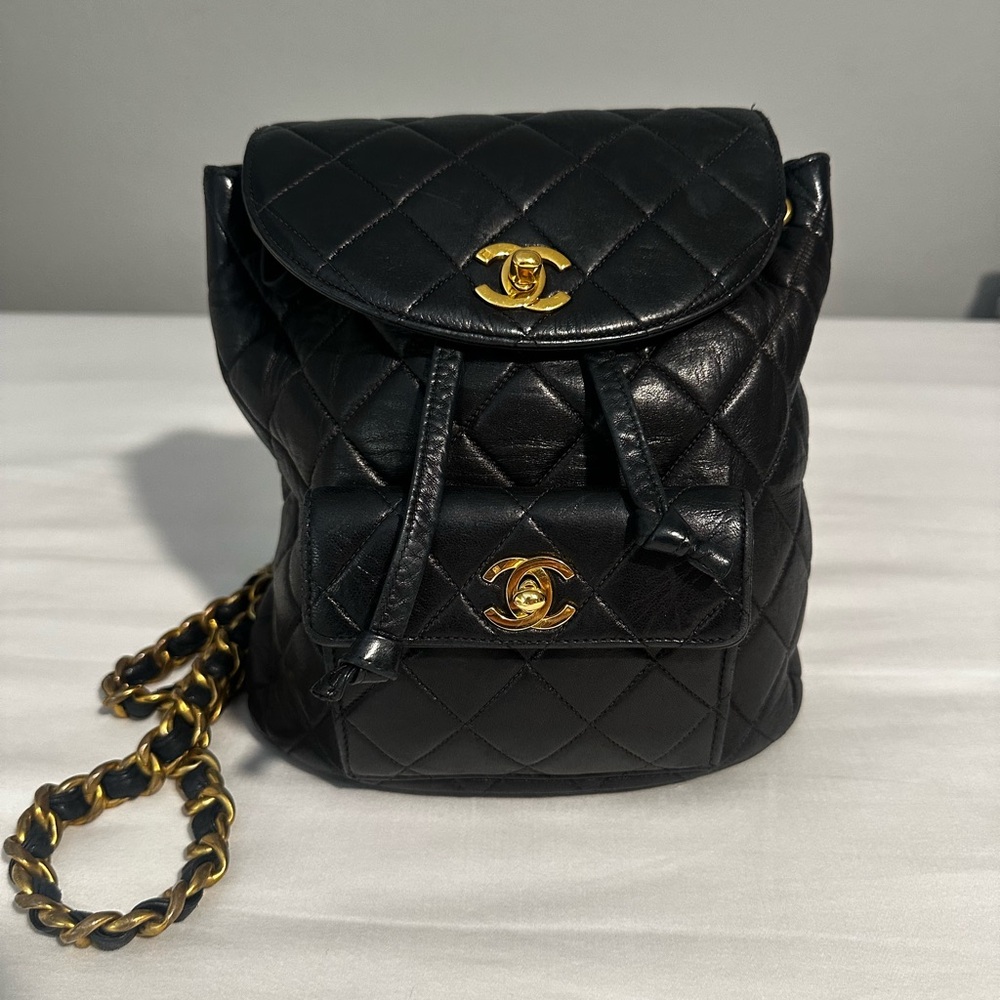 CHANEL Black Quilted Backpack with Gold Accents